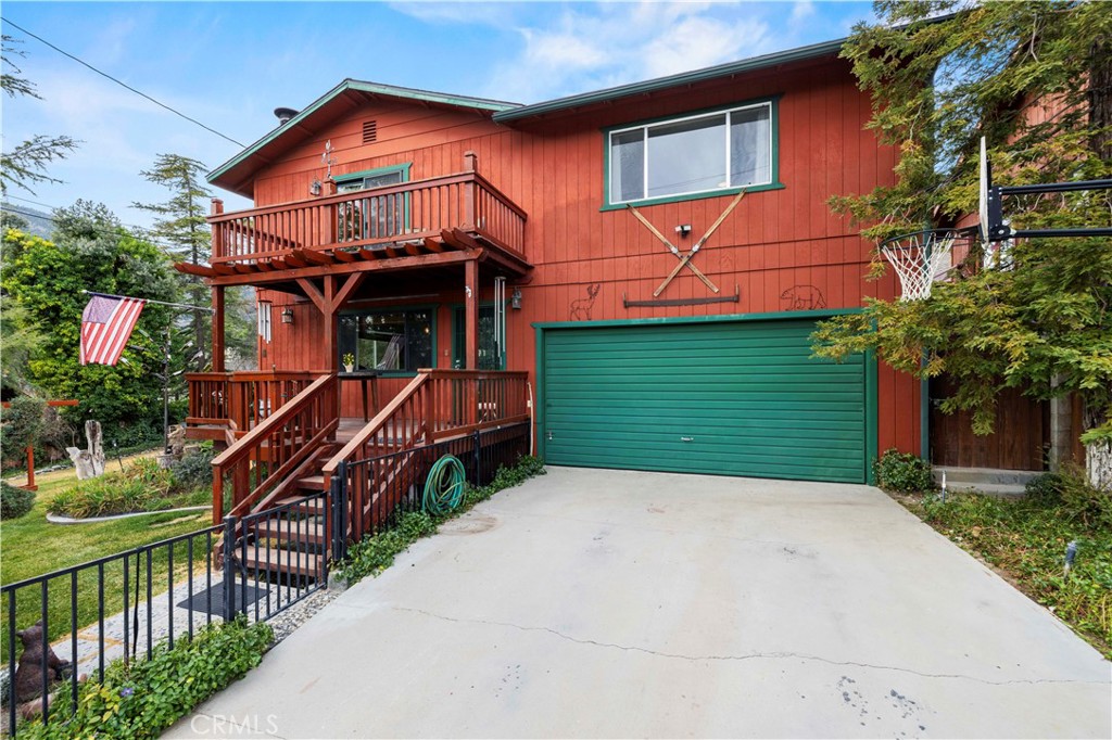 a front view of a house with wooden fence