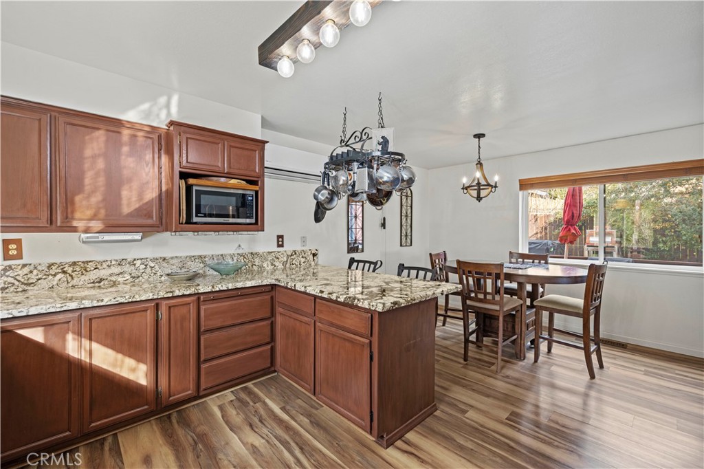 921 Piru Way Frazier Park, CA 93225 - Photo 17 of 62 a kitchen with sink cabinets and window