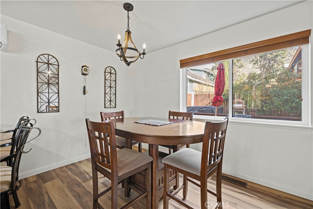 921 Piru Way Frazier Park, CA 93225 - Photo 18 of 62 a view of a dining room with furniture window and wooden floor