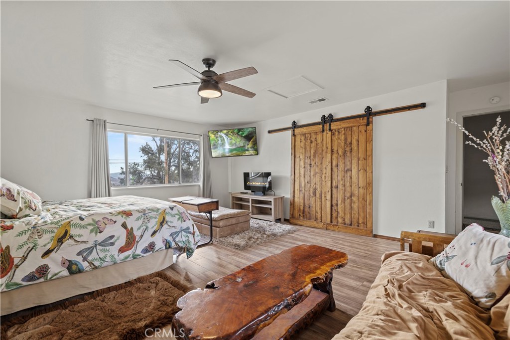 921 Piru Way Frazier Park, CA 93225 - Photo 25 of 62 a bedroom with bed and a window
