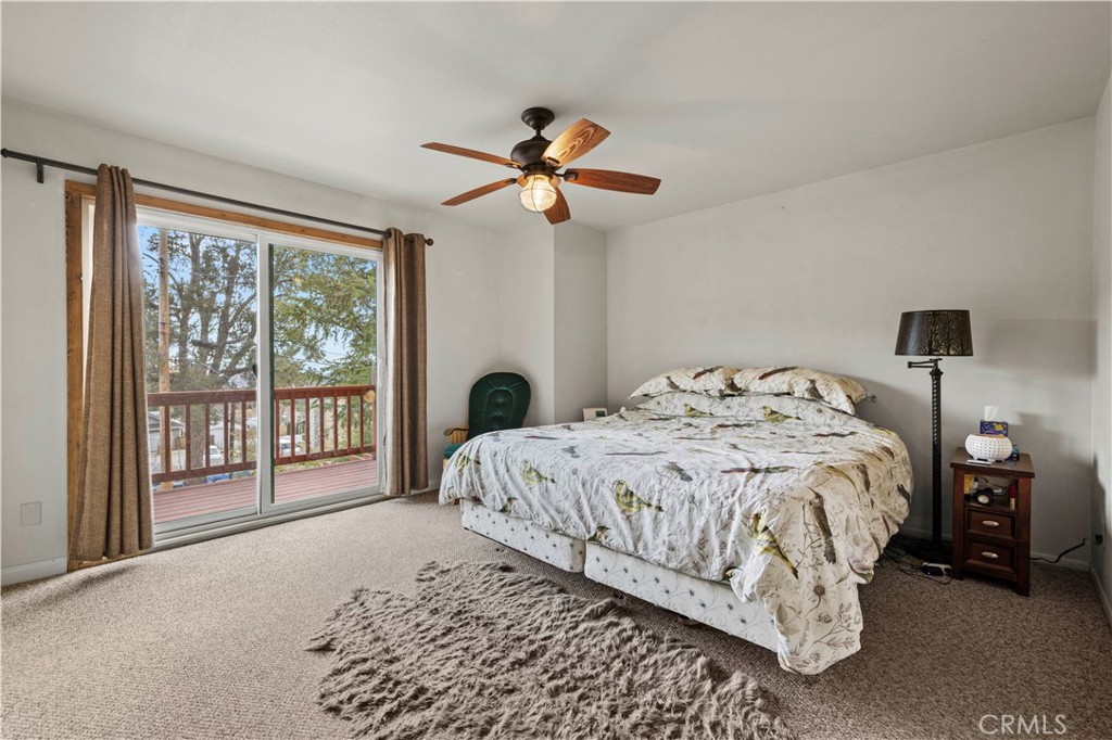 921 Piru Way Frazier Park, CA 93225 - Photo 28 of 62 a bedroom with a bed and a large window