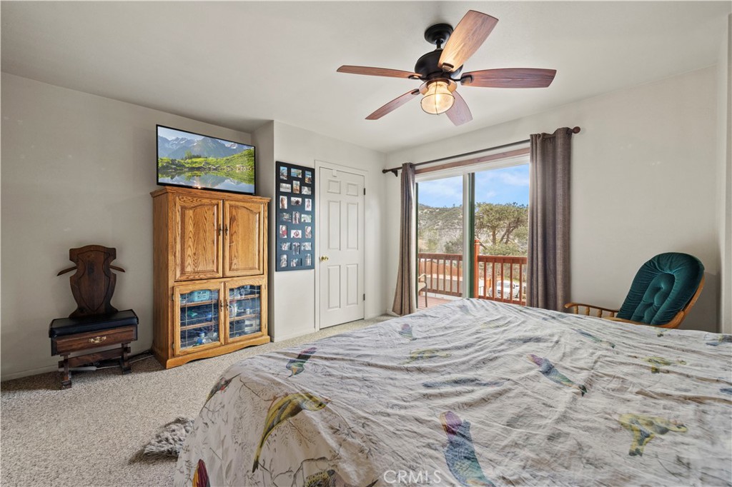 921 Piru Way Frazier Park, CA 93225 - Photo 29 of 62 a bedroom with a bed and a window