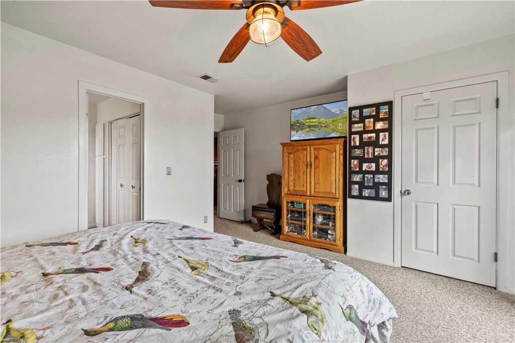 921 Piru Way Frazier Park, CA 93225 - Photo 30 of 62 a bedroom with a bed and a dresser