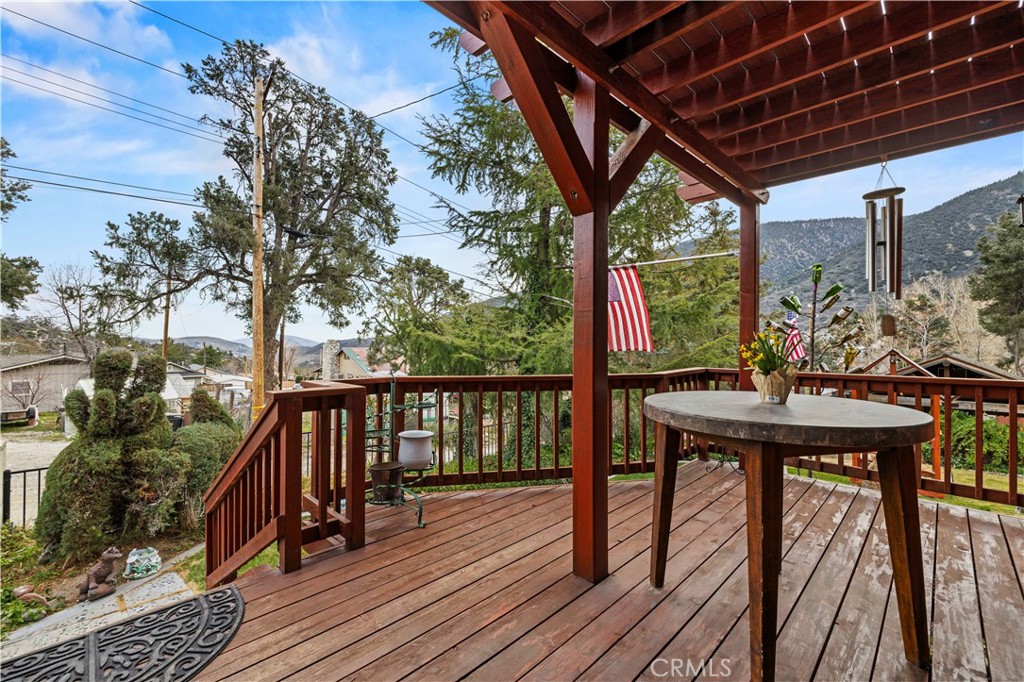 921 Piru Way Frazier Park, CA 93225 - Photo 3 of 62 a view of balcony with wooden floor and outdoor seating