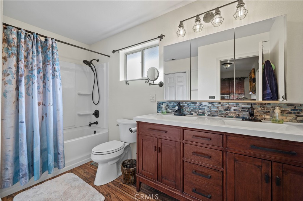 921 Piru Way Frazier Park, CA 93225 - Photo 33 of 62 a bathroom with a sink a toilet and shower