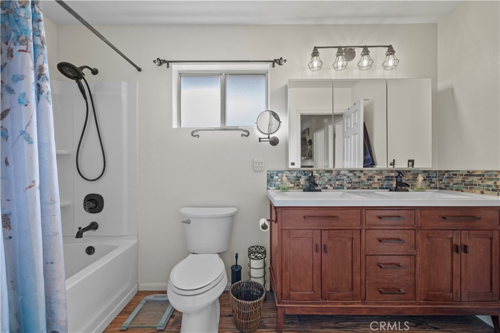 921 Piru Way Frazier Park, CA 93225 - Photo 34 of 62 a bathroom with a granite countertop sink toilet and shower