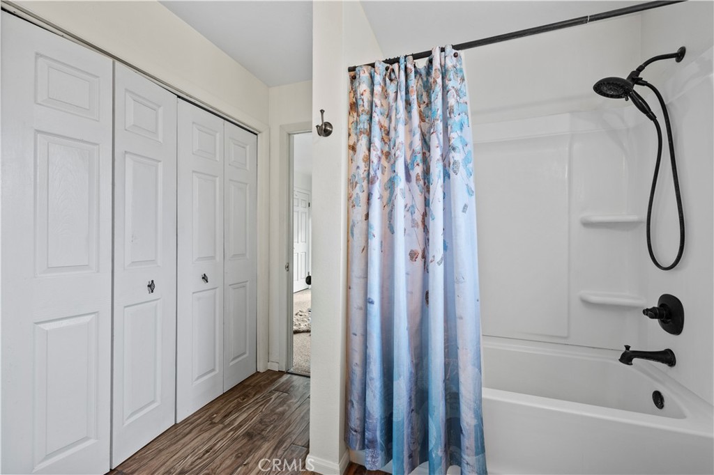 921 Piru Way Frazier Park, CA 93225 - Photo 35 of 62 a bathroom with a shower and a shower curtain