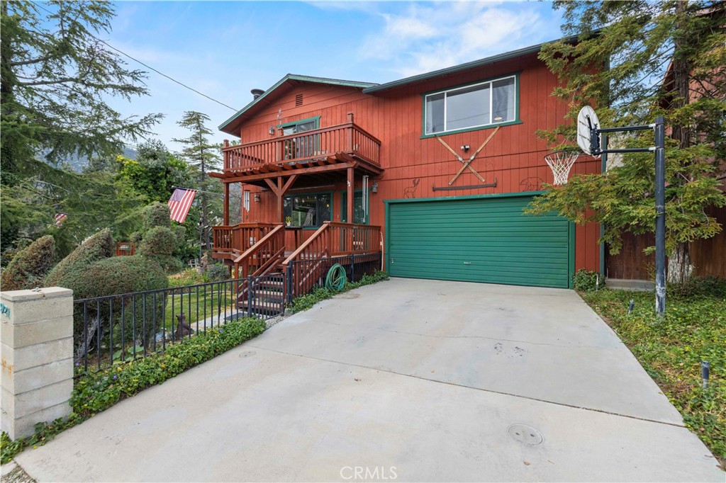 921 Piru Way Frazier Park, CA 93225 - Photo 46 of 62 a front view of a house with a yard and garage