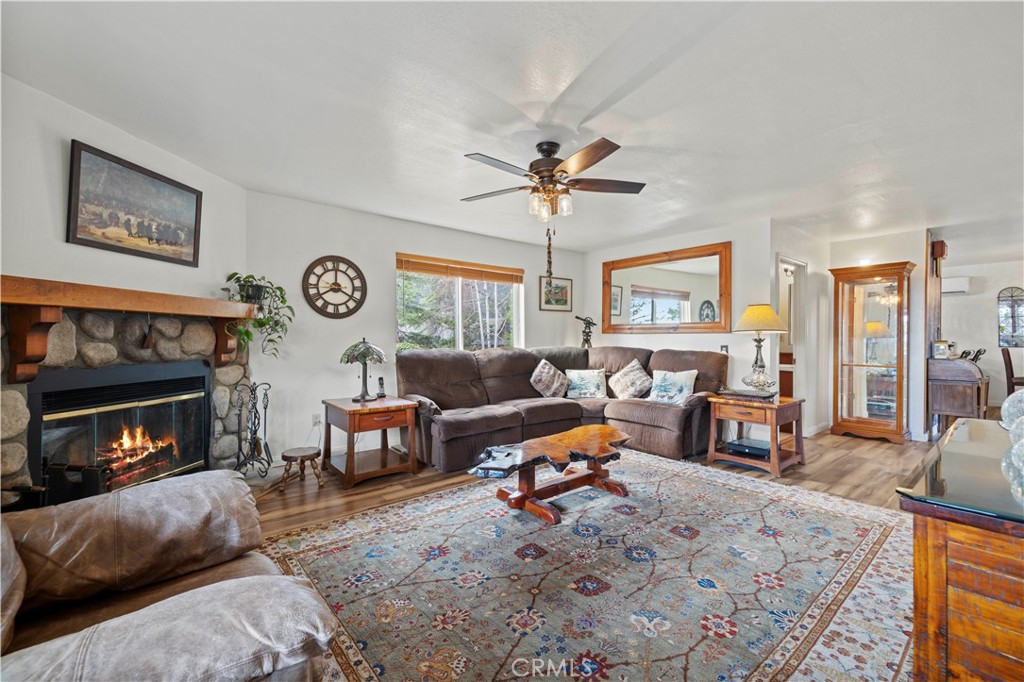 921 Piru Way Frazier Park, CA 93225 - Photo 6 of 62 a living room with furniture a fireplace and a window