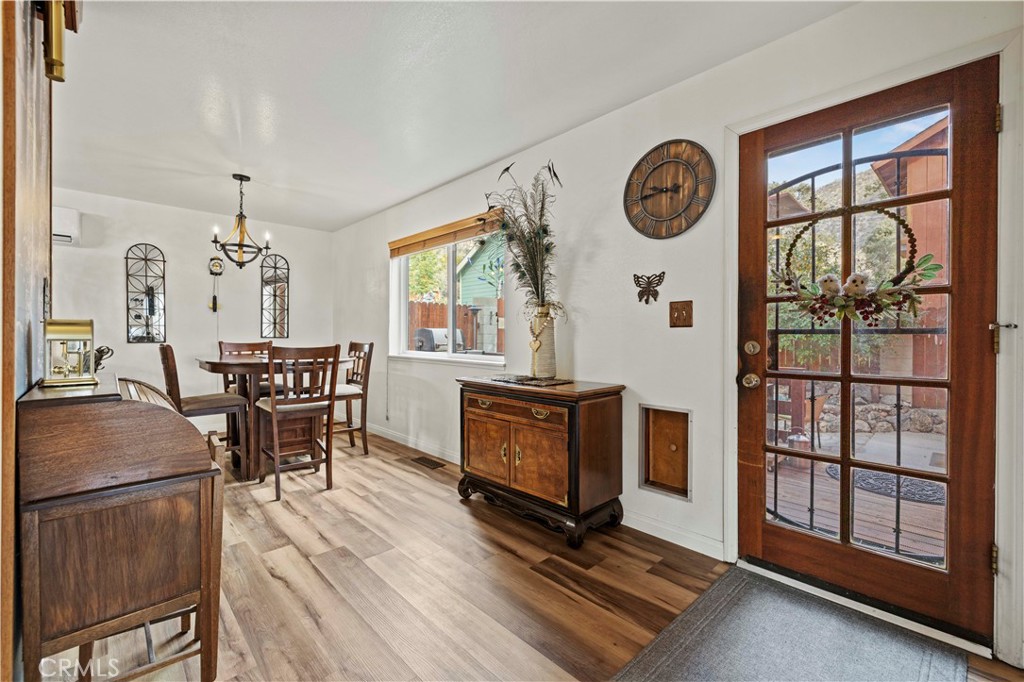 921 Piru Way Frazier Park, CA 93225 - Photo 10 of 62 a living room with furniture a dining table and a large window