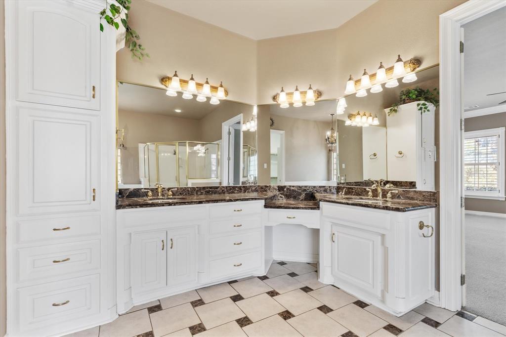 2080 County Road 2445 Decatur, TX 76234 - Photo 16 of 40 a large white kitchen with a white stove a sink dishwasher and a dining table with wooden floor