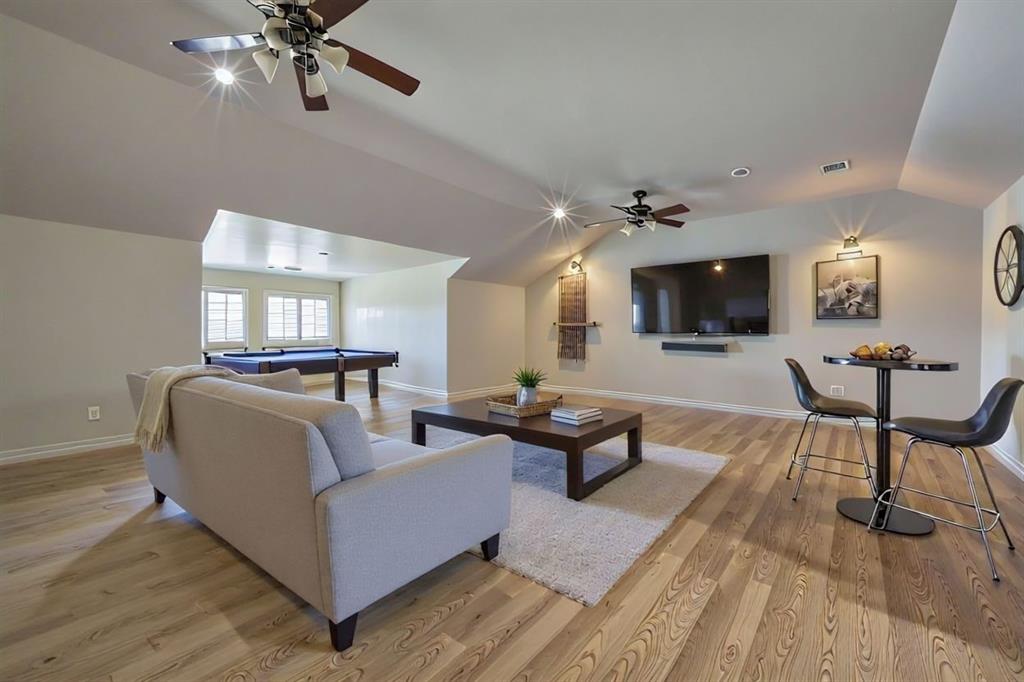 2080 County Road 2445 Decatur, TX 76234 - Photo 17 of 40 a living room with furniture and a flat screen tv