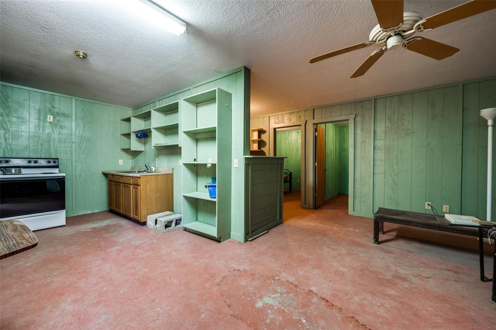 2080 County Road 2445 Decatur, TX 76234 - Photo 25 of 40 a view of a livingroom with furniture and a ceiling fan