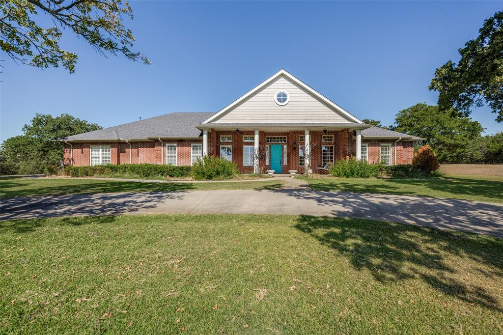 2080 County Road 2445 Decatur, TX 76234 - Photo 29 of 40 a front view of a house with a yard