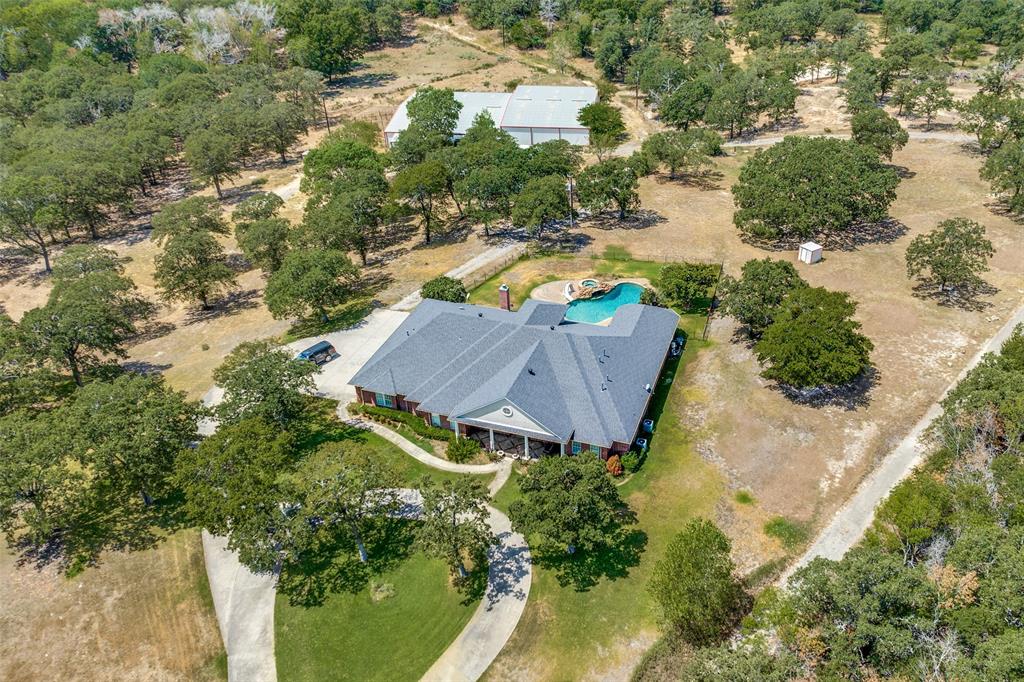 2080 County Road 2445 Decatur, TX 76234 - Photo 36 of 40 an aerial view of a house with yard swimming pool and lake view
