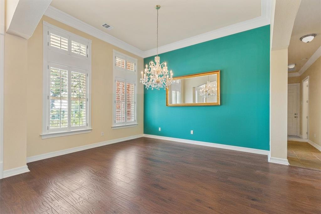2080 County Road 2445 Decatur, TX 76234 - Photo 7 of 40 a view of an empty room with wooden floor and a window