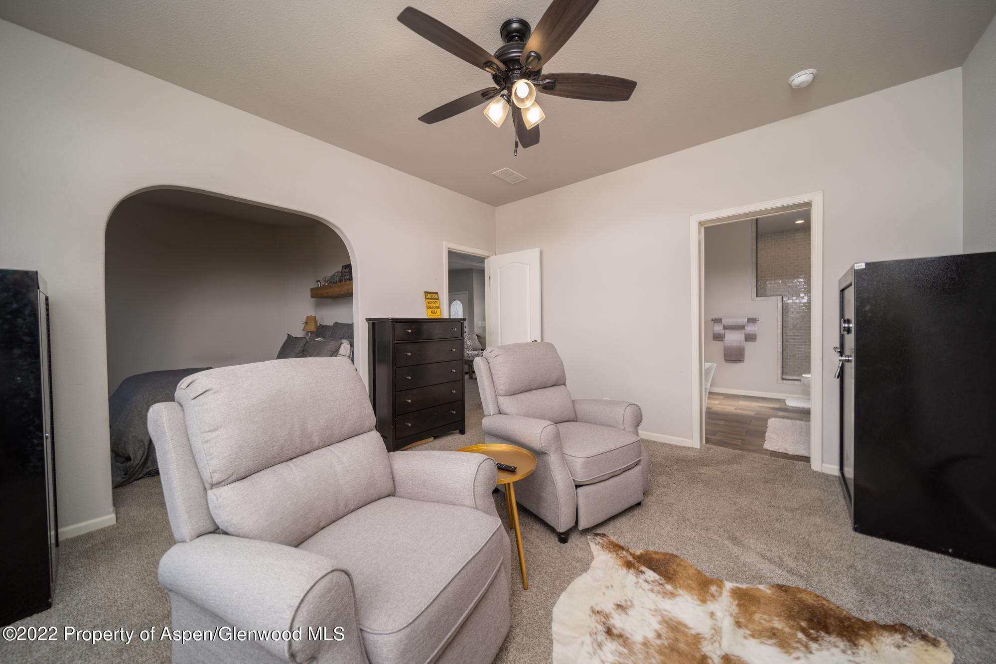 308 Cindys Way Rifle, CO 81650 - Photo 18 of 29 a living room with furniture and a flat screen tv