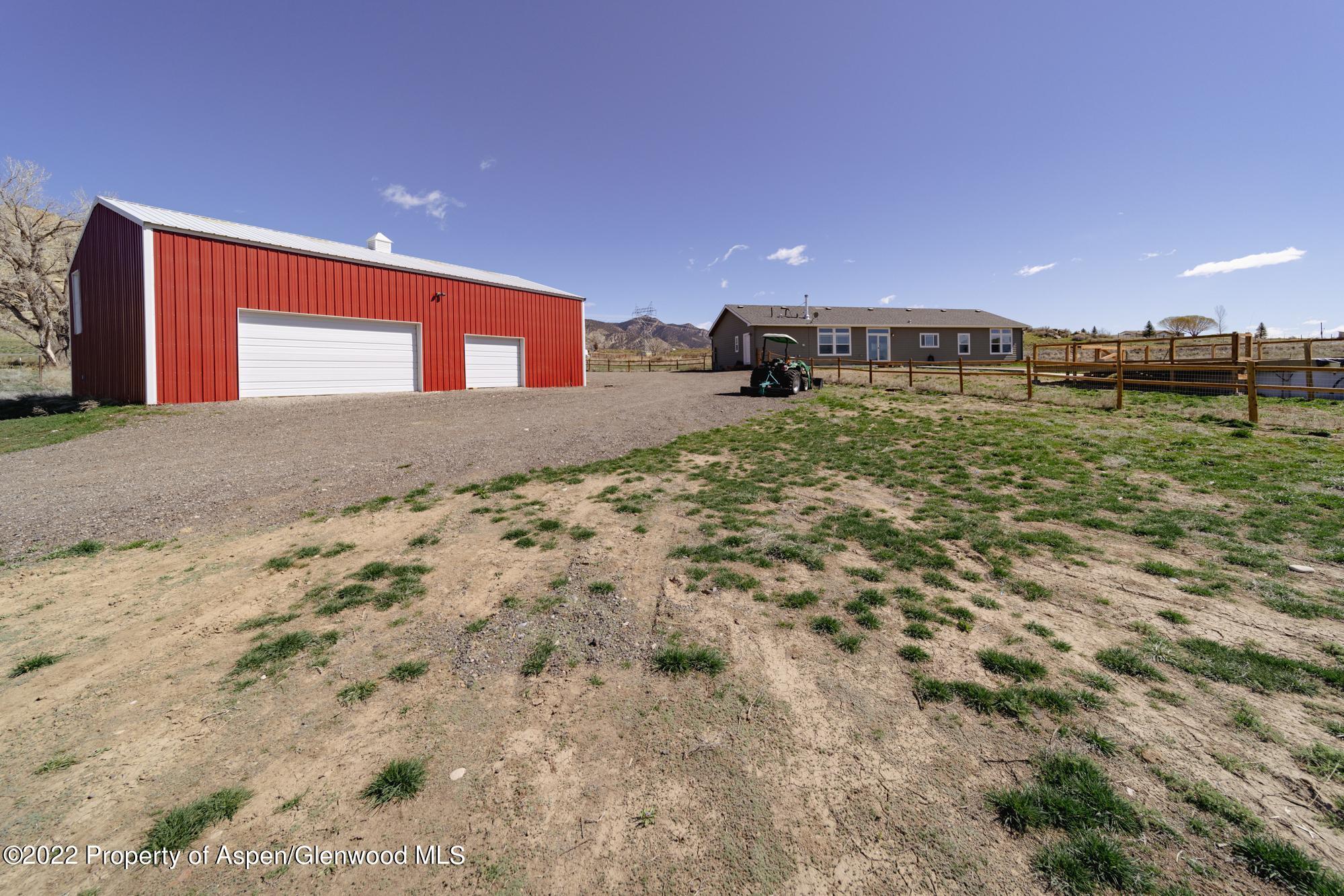 308 Cindys Way Rifle, CO 81650 - Photo 4 of 29 a view of a back yard of the building