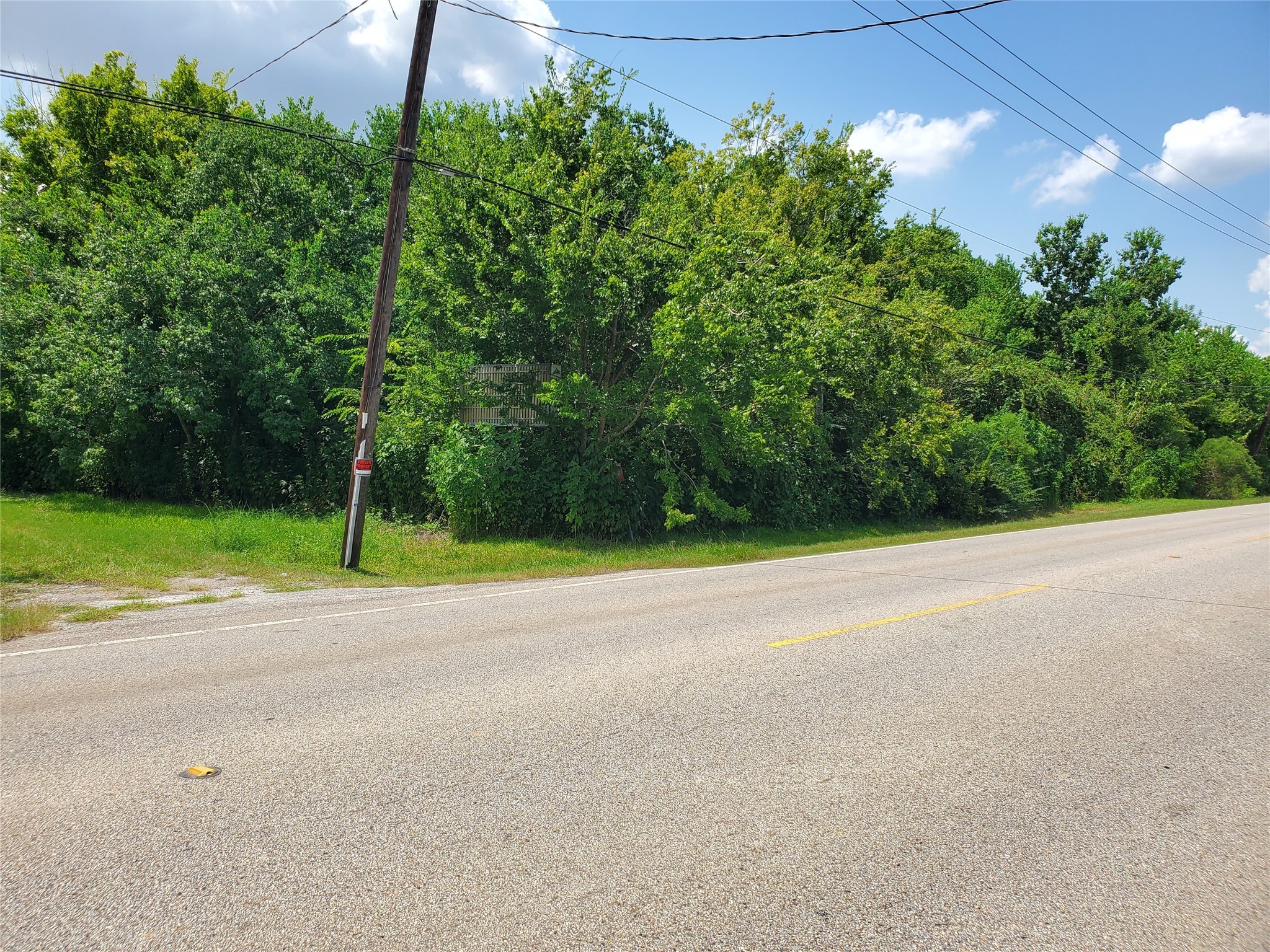 1635 West Cedar Bayou Lynchburg Road Baytown, TX 77521 - Photo 15 of 16 a view of a house with a yard