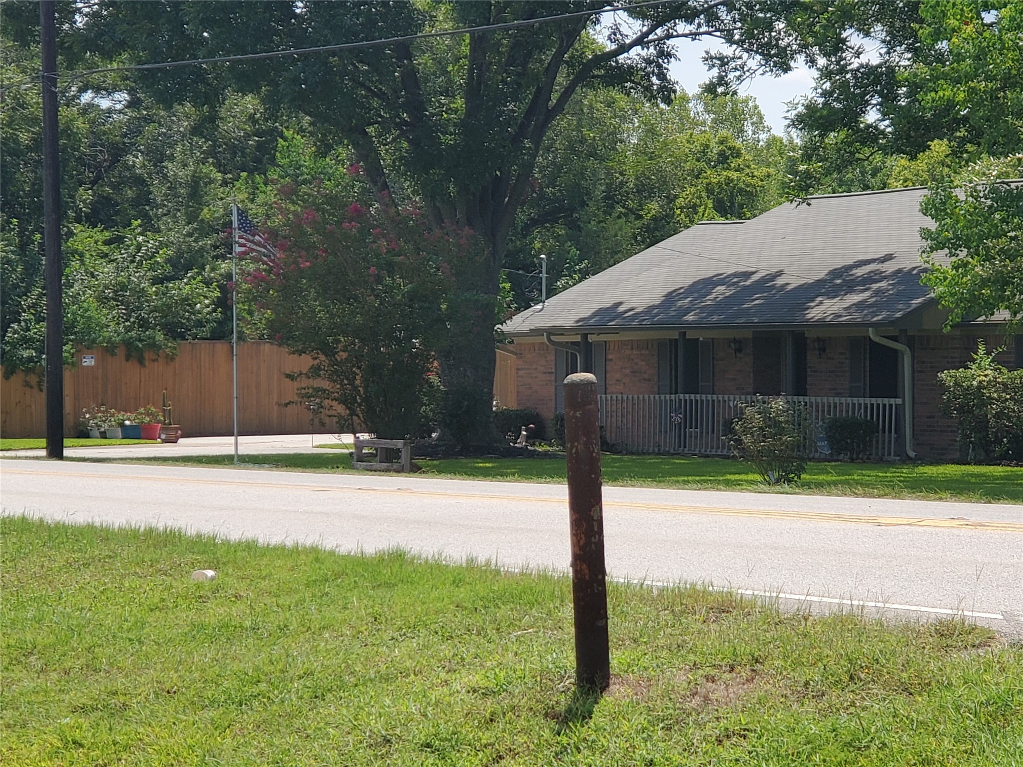 1635 West Cedar Bayou Lynchburg Road Baytown, TX 77521 - Photo 17 of 18 a house with a yard