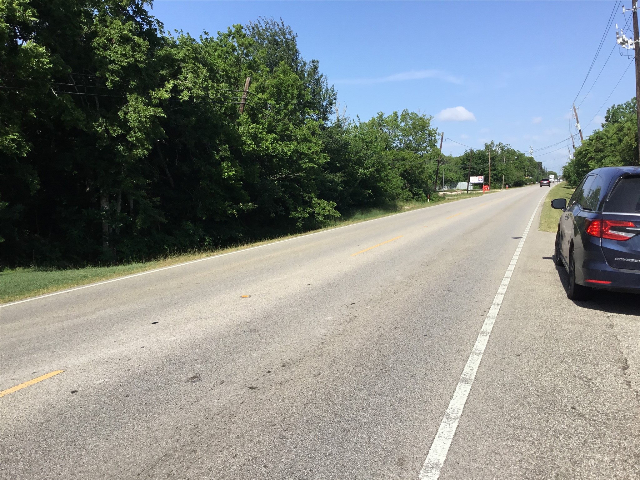 1635 West Cedar Bayou Lynchburg Road Baytown, TX 77521 - Photo 5 of 18 a car parked on the side of the road