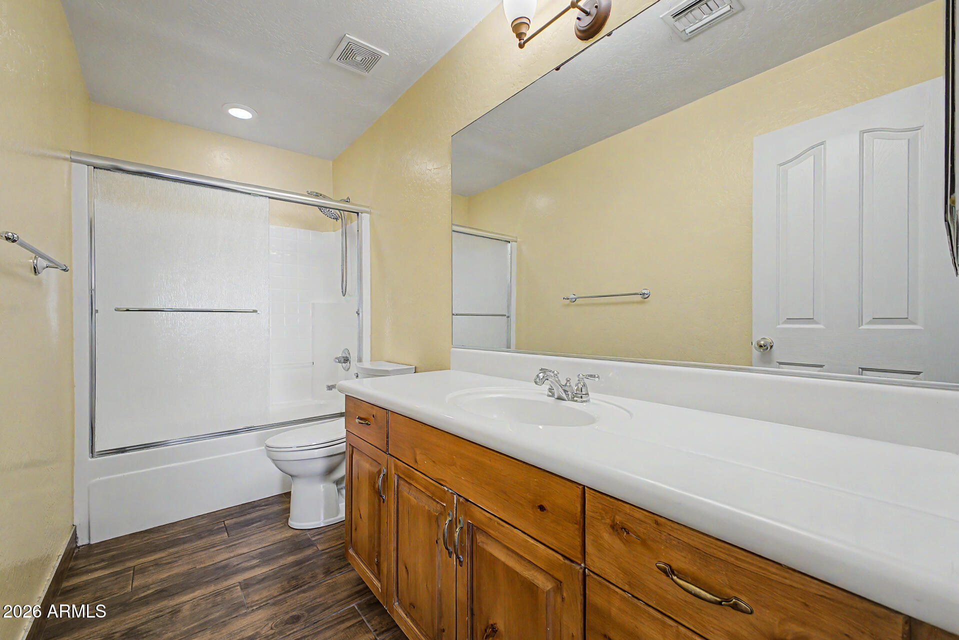 802 East Roberts Road Phoenix, AZ 85022 - Photo 17 of 24 a bathroom with a granite countertop sink toilet and shower
