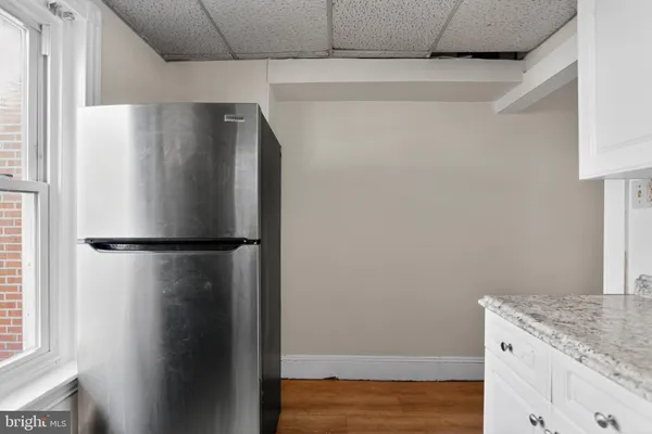 a kitchen with stainless steel appliances granite countertop a stove and a refrigerator