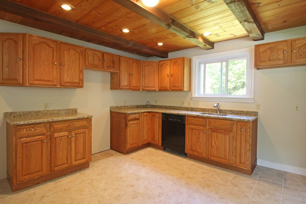 466 West Townsend Road Lunenburg, MA 01462 - Photo 3 of 13 a kitchen with granite countertop a sink cabinets stainless steel appliances and a window