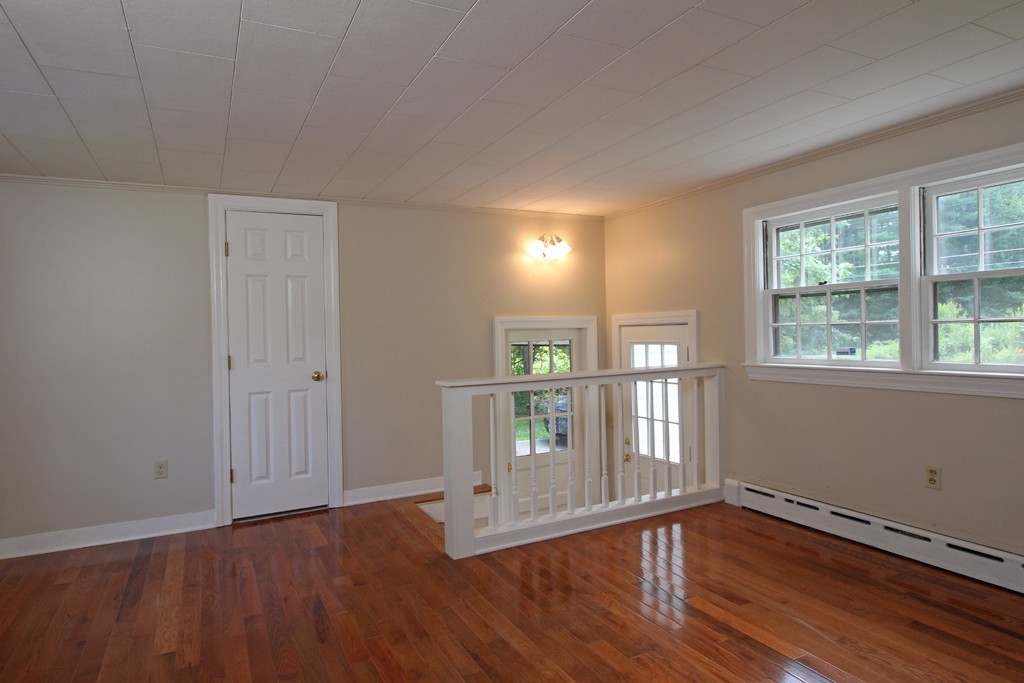 466 West Townsend Road Lunenburg, MA 01462 - Photo 8 of 13 a view of empty room with wooden floor