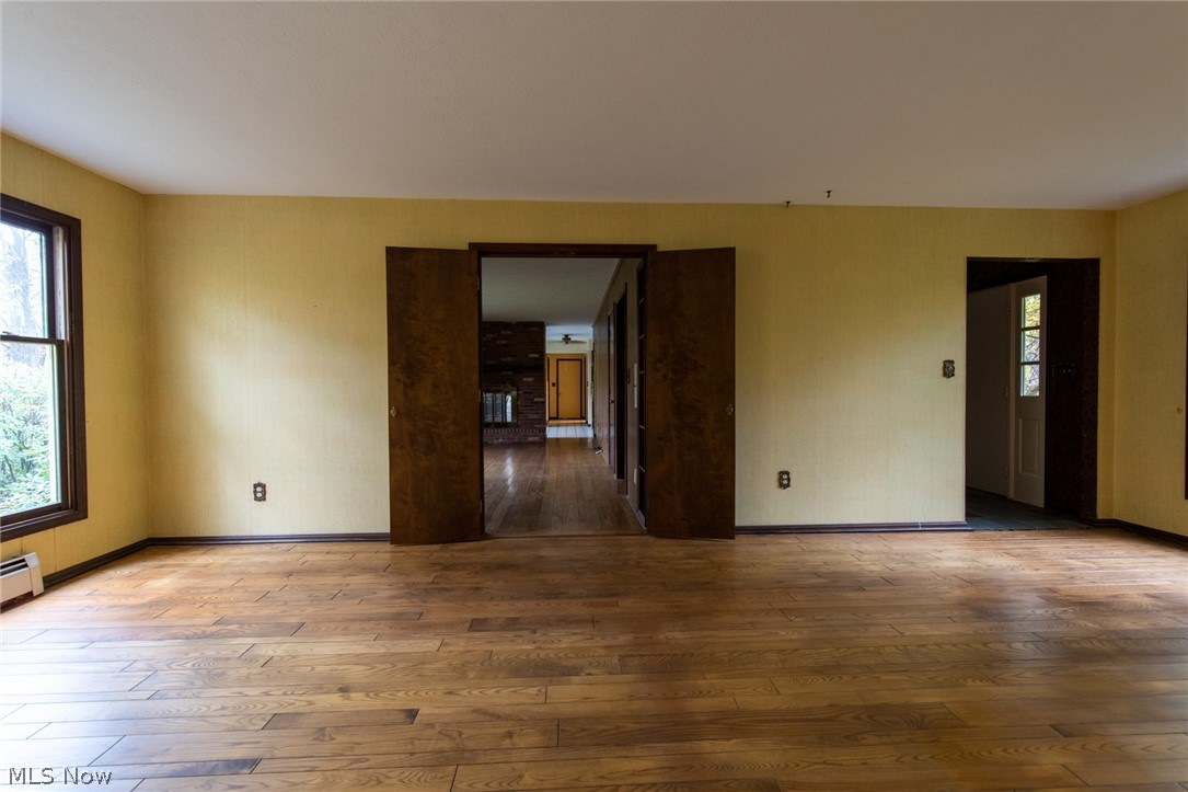 10170 Sherman Road Chardon, OH 44024 - Photo 15 of 35 Family room doors swing open for full site line through the living room to the kitchen