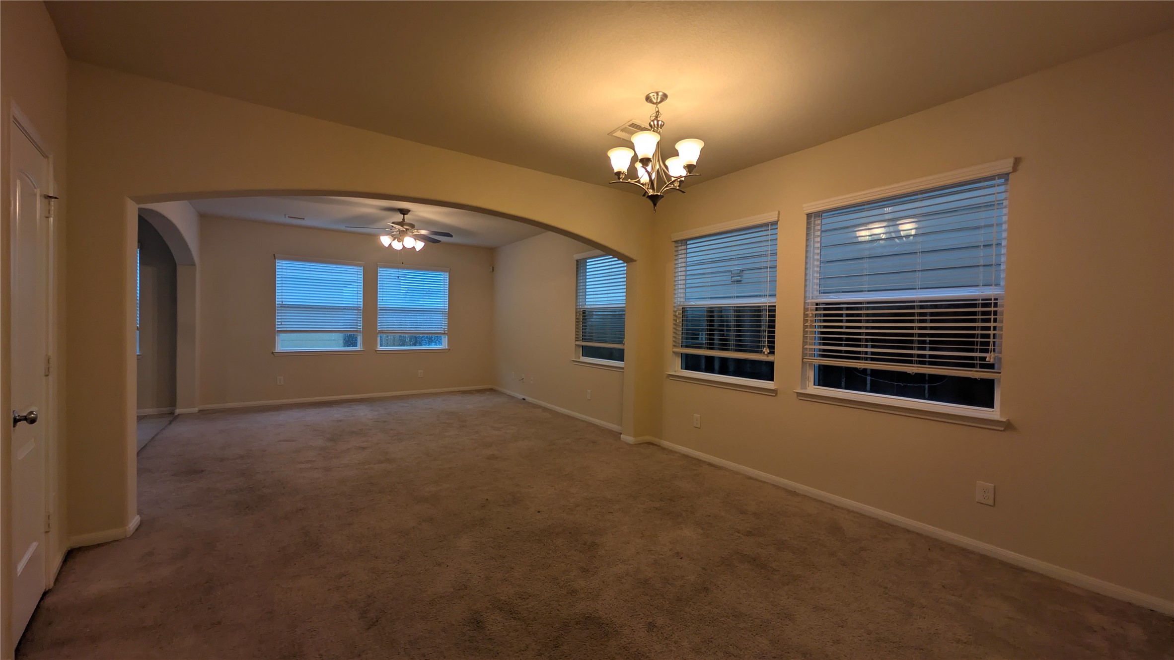 7326 Granite Terrace Lane Houston, TX 77083 - Photo 4 of 39 a view of an empty room with a chandelier