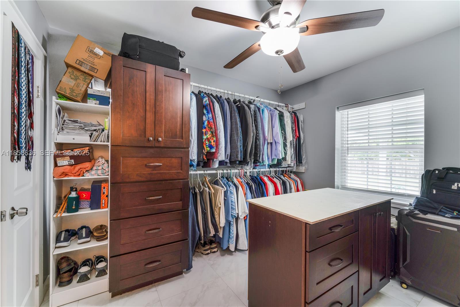 512 Northwest 13th Street Homestead, FL 33030 - Photo 23 of 39 a view of walk in closet and bedroom