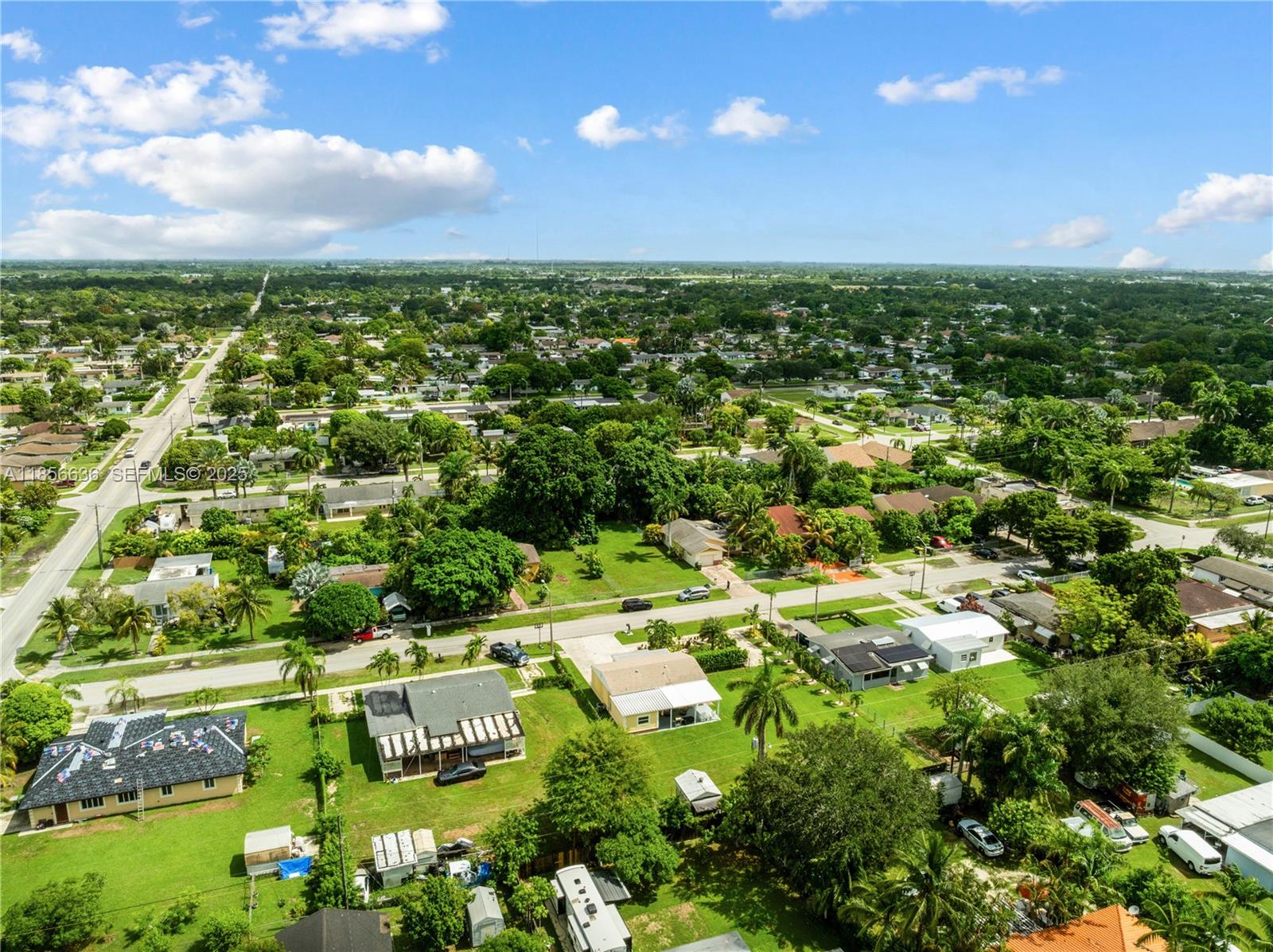 512 Northwest 13th Street Homestead, FL 33030 - Photo 32 of 39 an aerial view of residential houses with outdoor space and trees