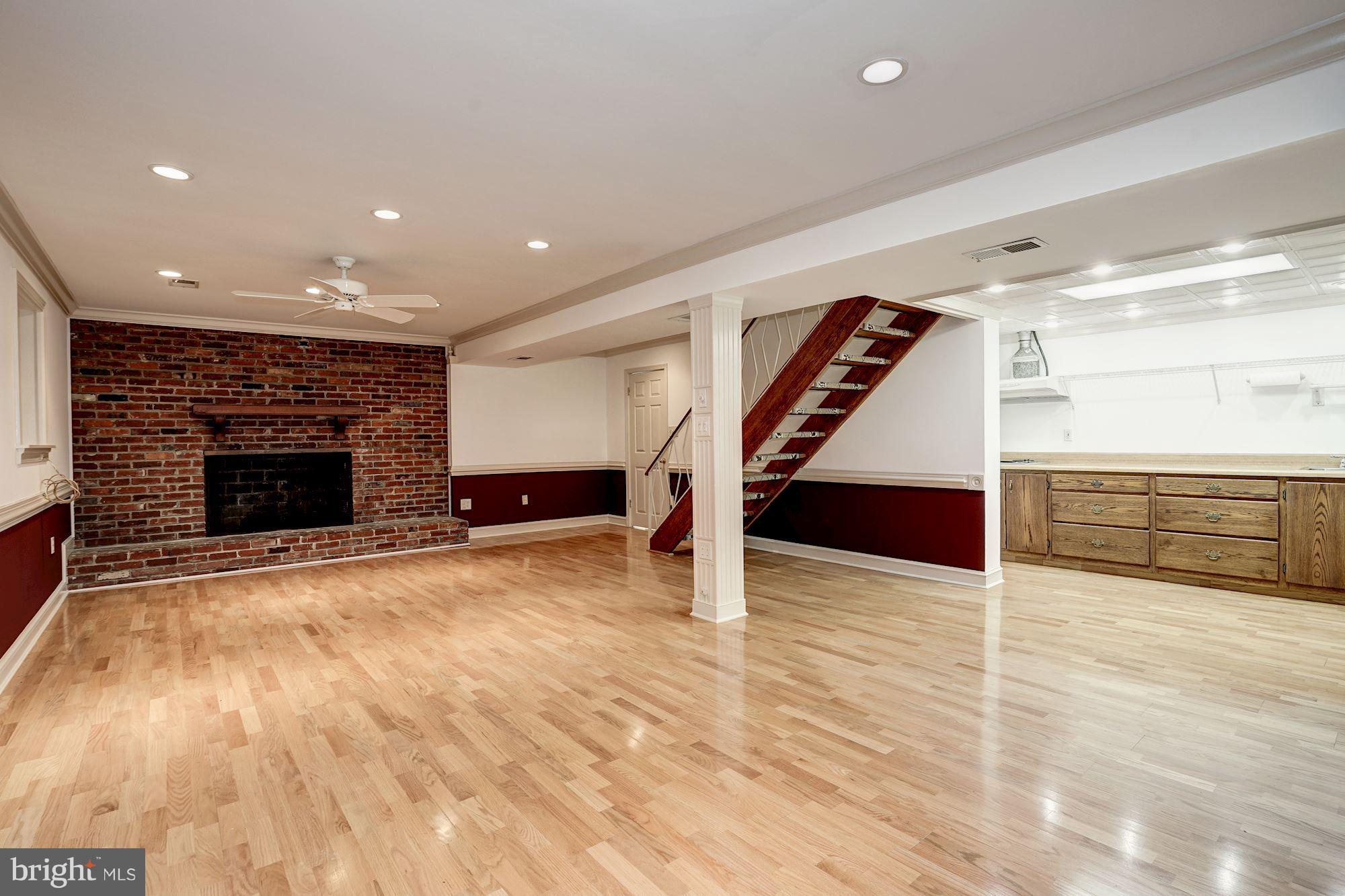 6201 Tyner Street Springfield, VA 22152 - Photo 24 of 30 Recreation: hardwoods & fireplace