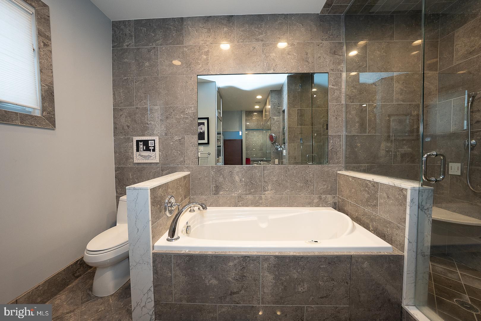7 Brettagne, Unit 7 Devon, PA 19333 - Photo 25 of 48 Primary Bath with steam shower and soaking tub