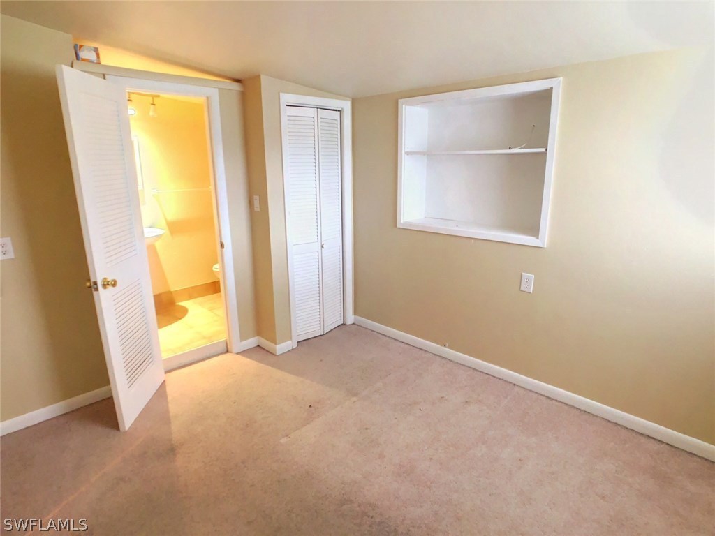 18531 Geranium Road Fort Myers, FL 33967 - Photo 8 of 11 a view of an empty room with a window