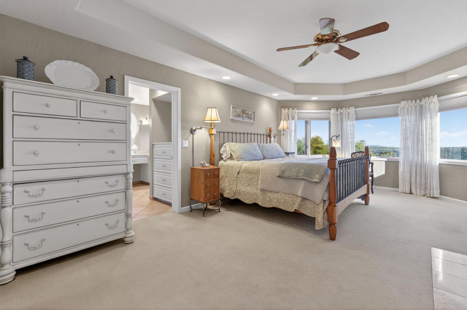 7570 Airola Road Vallecito, CA 95251 - Photo 38 of 90 a bedroom with a bed and a ceiling fan
