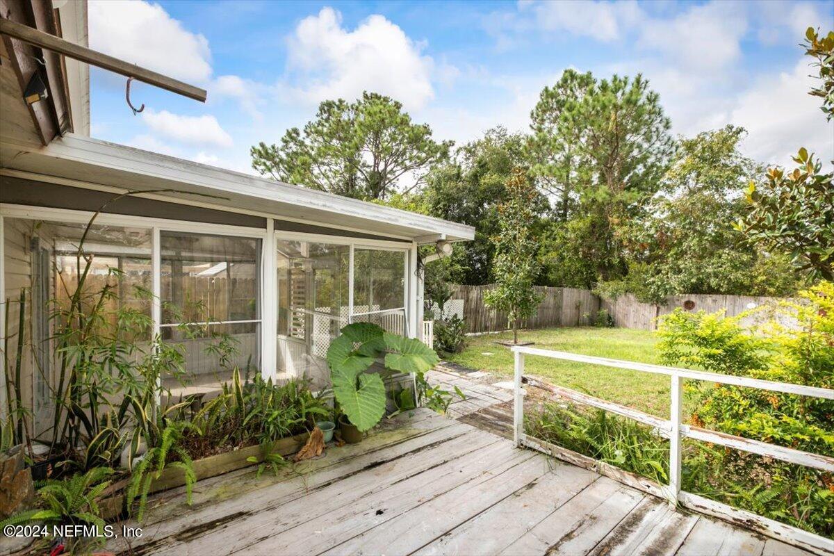 2432 Wattle Tree Road East Jacksonville, FL 32246 - Photo 4 of 25 a view of a house with backyard and sitting area