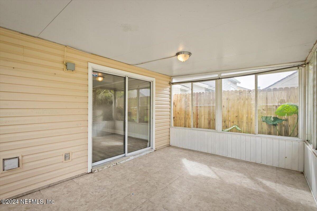 2432 Wattle Tree Road East Jacksonville, FL 32246 - Photo 6 of 25 a view of an empty room and window