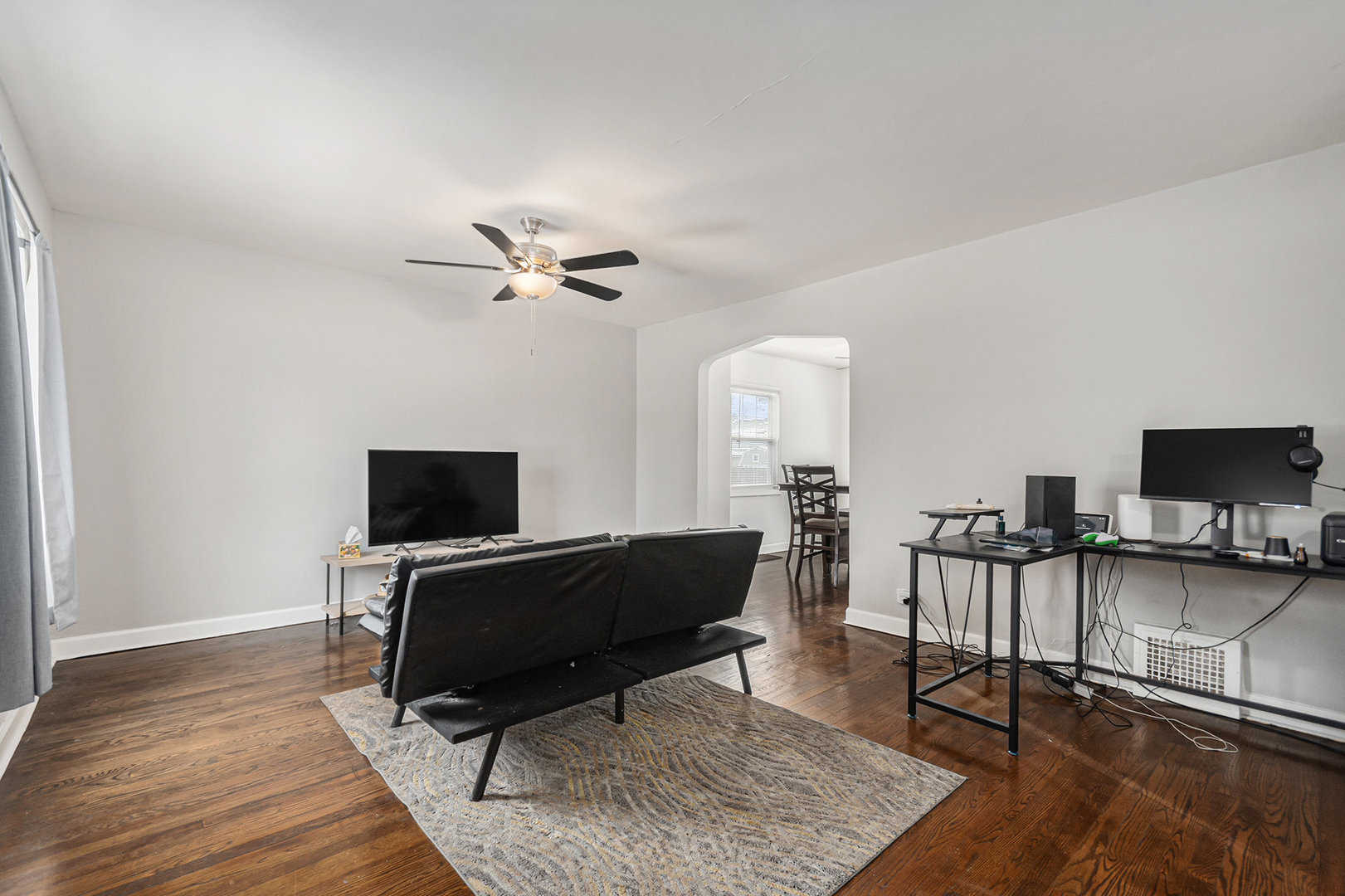 2316 South 10th Avenue Broadview, IL 60155 - Photo 2 of 19 a living room with furniture and a flat screen tv