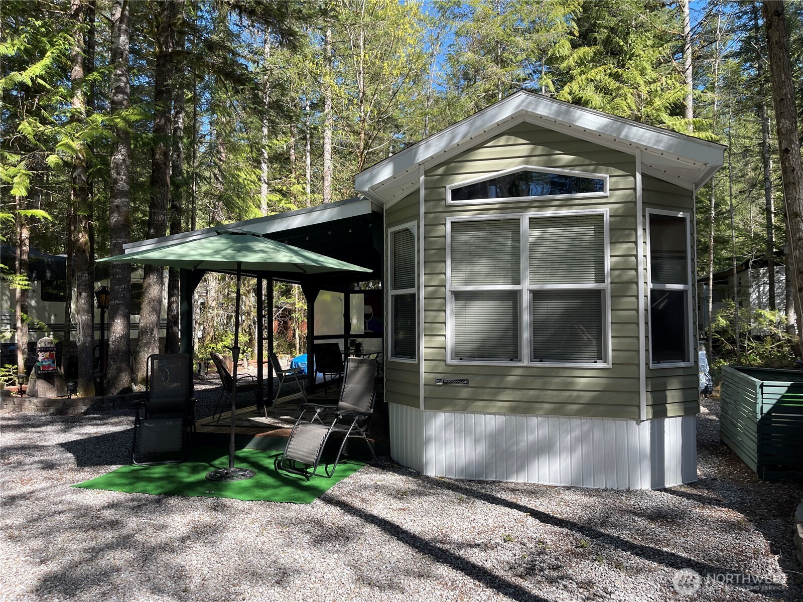 53 Branch Circle Maple Falls, WA 98266 - Photo 1 of 39 a front view of a house with garden