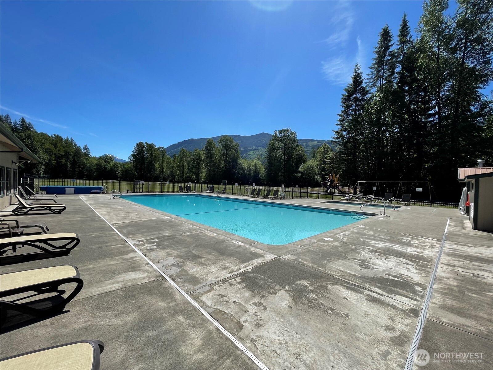 53 Branch Circle Maple Falls, WA 98266 - Photo 30 of 39 a view of a swimming pool with a yard
