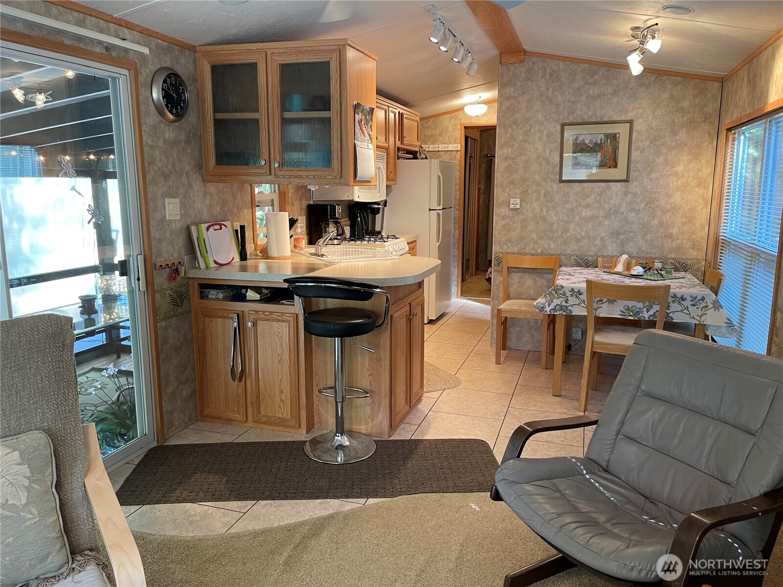 53 Branch Circle Maple Falls, WA 98266 - Photo 9 of 39 a living room with furniture a flat screen tv and next to a window