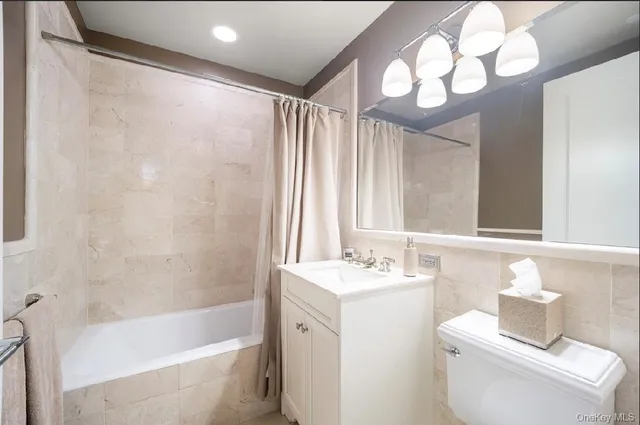 a bathroom with a sink a toilet and a bathtub