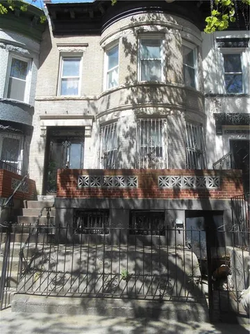 a view of a building with a porch