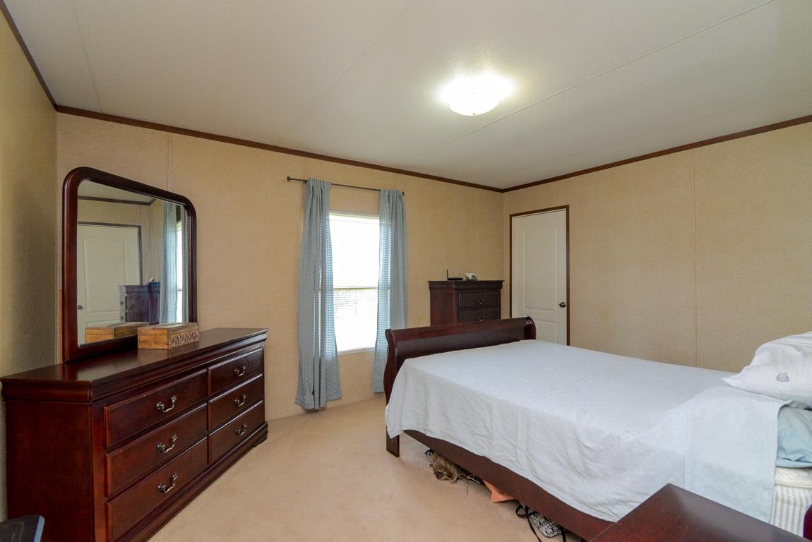 78 Tomlinson Road Lebanon, TN 37087 - Photo 6 of 13 a bedroom with a bed and a dresser