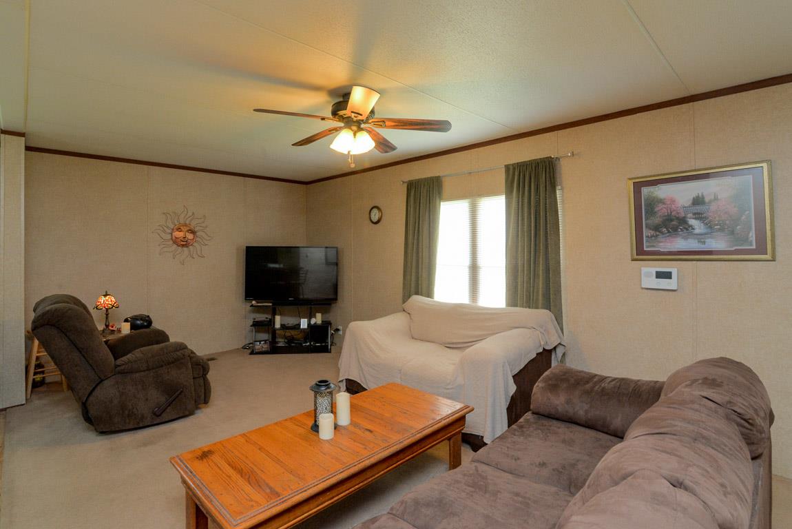 78 Tomlinson Road Lebanon, TN 37087 - Photo 9 of 13 a living room with furniture and a flat screen tv