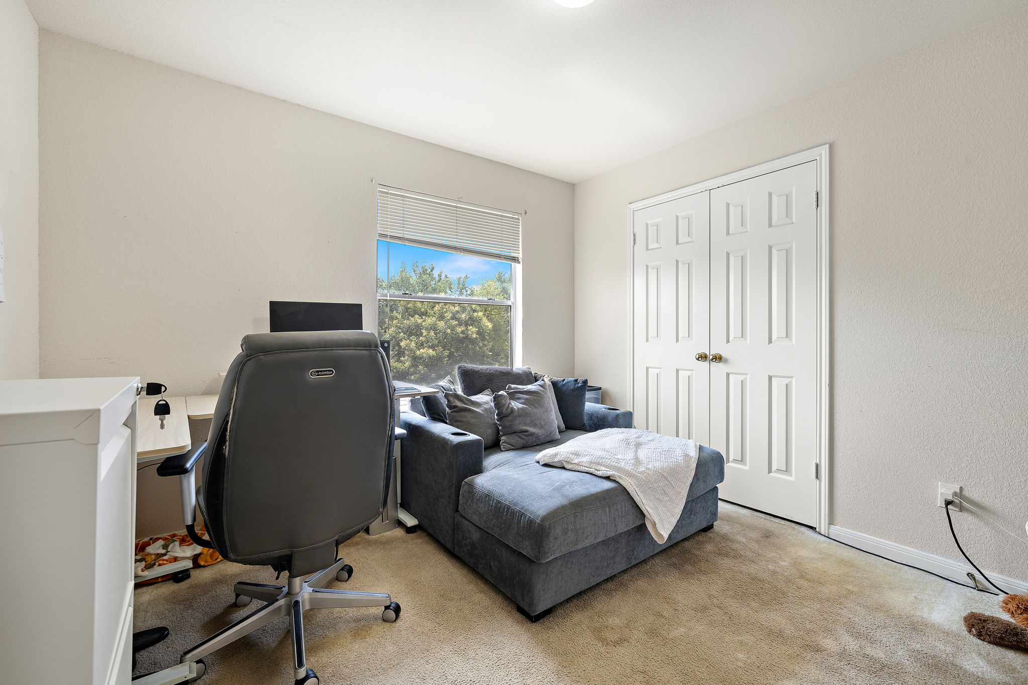 615 Runners Ridge Pflugerville, TX 78660 - Photo 24 of 32 a bedroom with a bed and a window