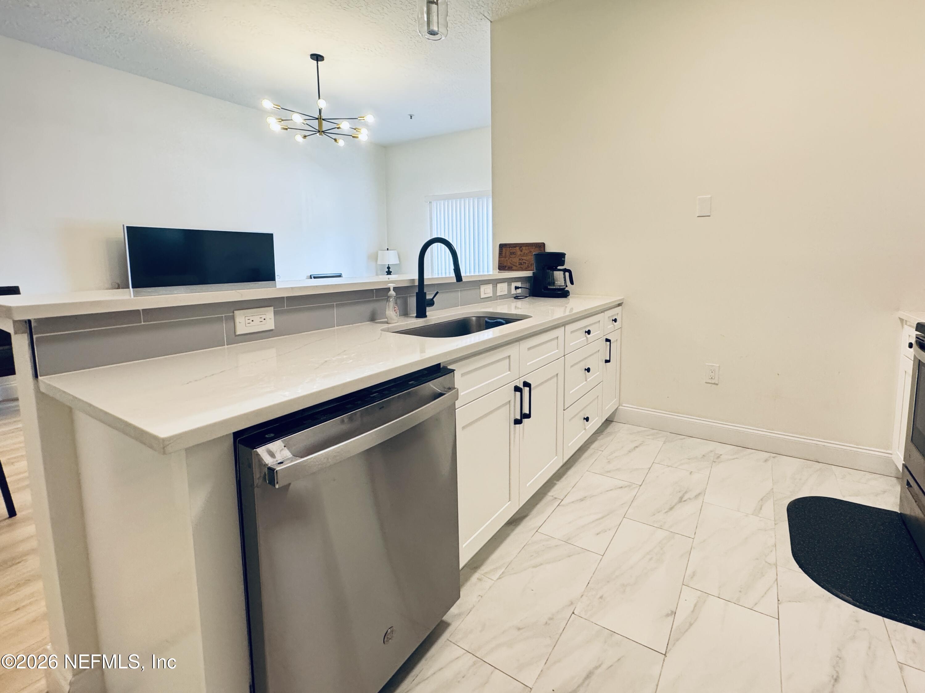 7920 Merrill Road, Unit 1205 Jacksonville, FL 32277 - Photo 10 of 25 Kitchen Island