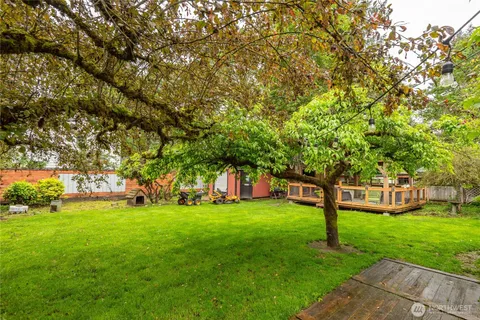 a view of a tree in front of a house